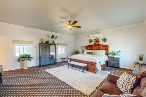 a bedroom with a bed and a ceiling fan at Guglielmo Winery Casetta in Morgan Hill
