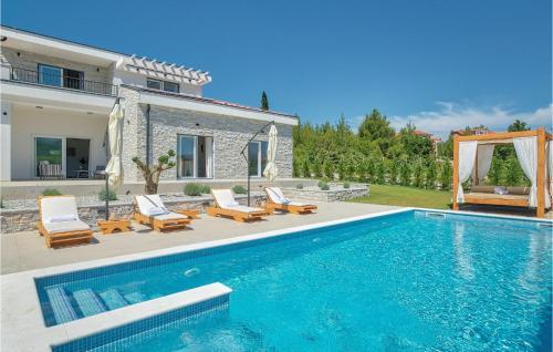 a villa with a swimming pool and a house at Villa Ena Mar in Zadar