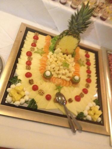 a plate of food with a pineapple on it at Gostisce Golob in Zgornja Polskava