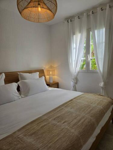 Ліжко або ліжка в номері Beach-Cottage