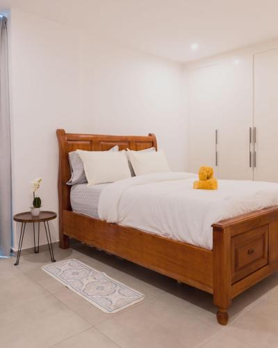 En eller flere senger på et rom på Luxury Apartment at Nova