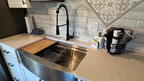 a kitchen counter with a sink and a sink at The Shophouse at Transplant Acres in Bandera