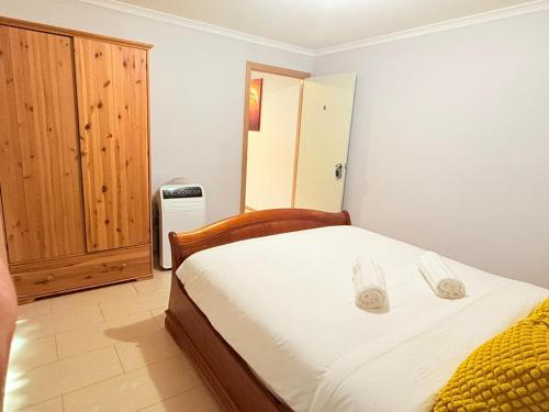 Postel nebo postele na pokoji v ubytování YF Home Sweet Home