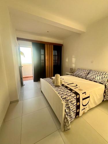Una cama o camas en una habitación de Oásis de retour