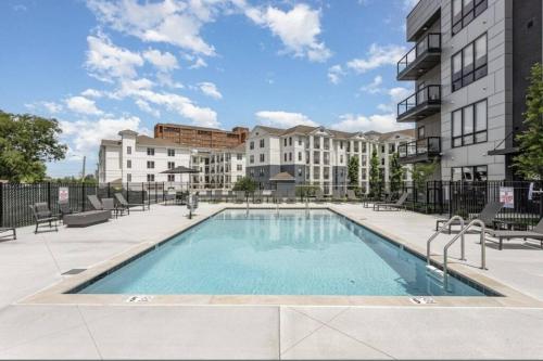 a swimming pool in the middle of a building at Electric - Odyssey -Top Floor West End 2 Bedroom - Minutes to Broadway in Nashville