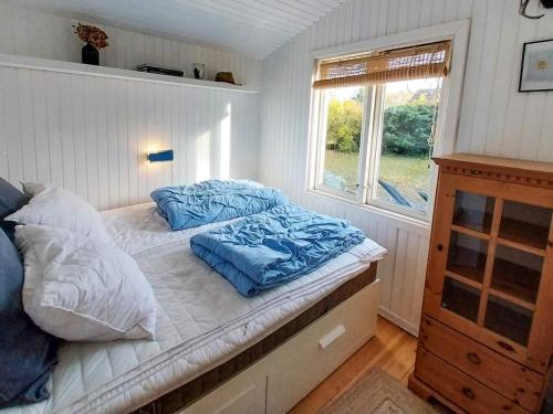 Postel nebo postele na pokoji v ubytování 6 person holiday home in Jægerspris-By Traum