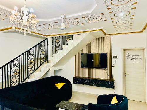 Телевизор и/или развлекательный центр в Villa Amina