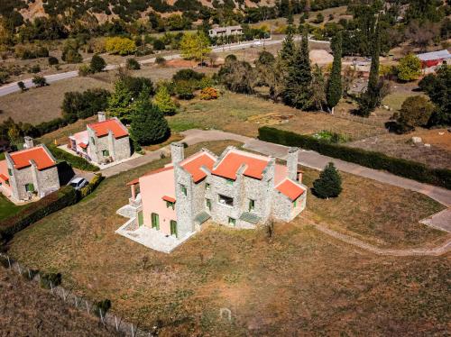 an aerial view of a large house on a field at Kalavryta Estate Villa in Kalavrita