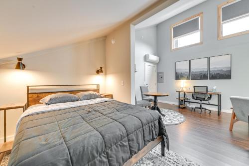 a bedroom with a bed and a living room at Old Forge Studio: Close to Lakes & Hiking Trails in Old Forge