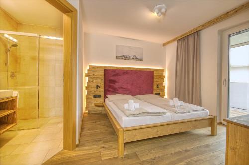 Posteľ alebo postele v izbe v ubytovaní Alpin & Seeresort Top 14 - by Alpen Apartments