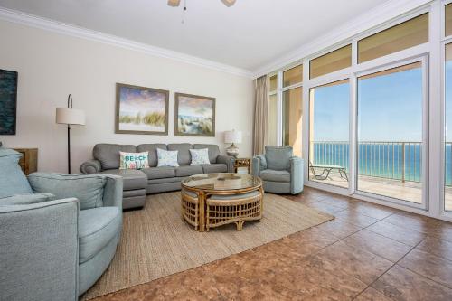 a living room with a view of the ocean at Phoenix Gulf Shores 803 condo in Gulf Shores