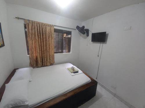 Una cama o camas en una habitación de Hotel primaveral