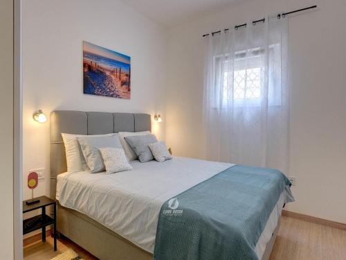 Ένα ή περισσότερα κρεβάτια σε δωμάτιο στο Apartment in Valtura with Family-Friendly Yard