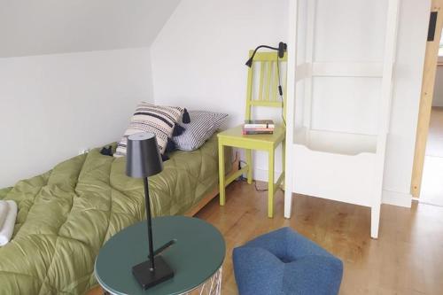 a living room with a green couch and a table at Holiday Home in Sieciemin near Baltic Coast in Sieciemin
