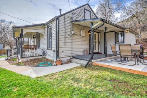 a small house with a porch and a patio at 1BR Quiet Neighborhood & Nearby Parks in Manitou Springs