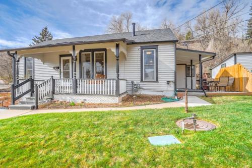 a small house with a porch and a yard at 1BR Quiet Neighborhood & Nearby Parks in Manitou Springs