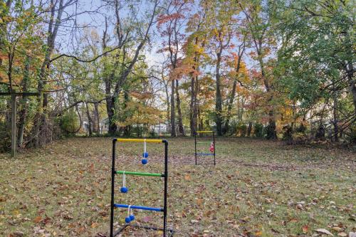 two play equipment in a park with fall foliage at Game Room and Huge Yard with Fire Pit Yard Games and BBQ Near UE and Downtown in Evansville