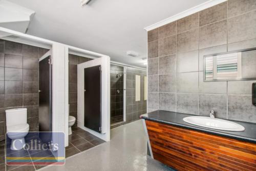 a bathroom with a sink and a toilet at Avenues Xchange in Aitkenvale
