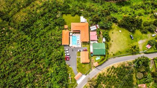 an aerial view of a house with a road at Hotel Campestre Villa Salome in Quimbaya