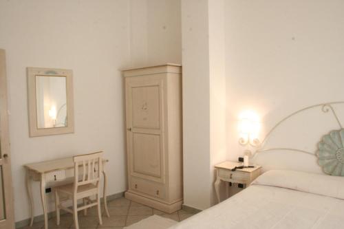 Una cama o camas en una habitación de Hotel Sorgente