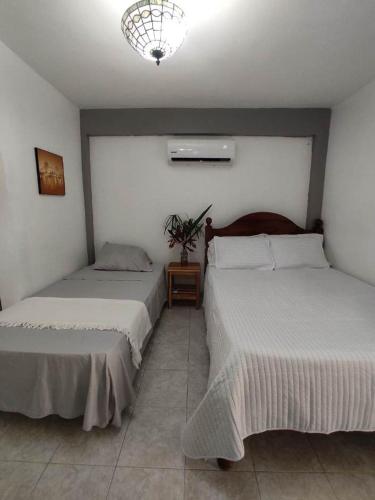 Postel nebo postele na pokoji v ubytování Quinta Xcaret