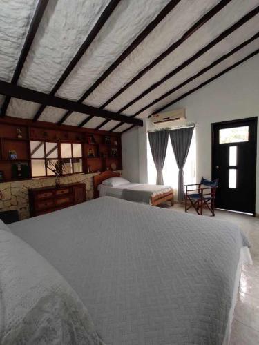 Postel nebo postele na pokoji v ubytování Quinta Xcaret