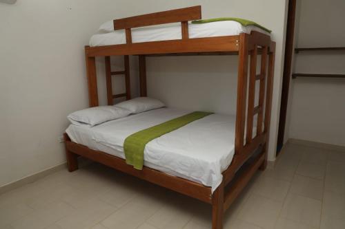 a bedroom with two bunk beds in a room at Yalakú Lodge - Capurganá in Capurganá