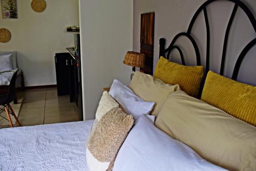 Postel nebo postele na pokoji v ubytování Villa Buenaventura Loft