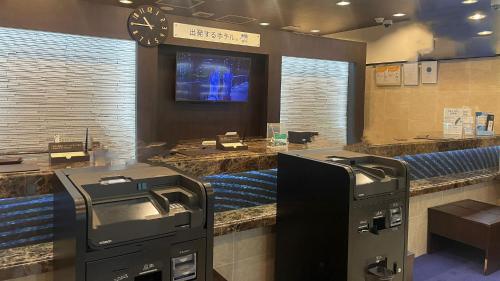 a waiting room with a cash register and a tv at Toyoko Inn Tokyo Asakusa Kuramae No.2 in Tokyo