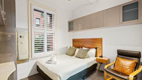 Ένα ή περισσότερα κρεβάτια σε δωμάτιο στο Gordon House Apartments