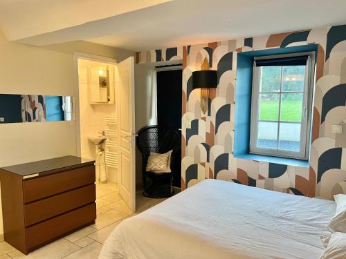 a bedroom with a large bed and a window at The Chateau 45Pers, 30min from Sea in Amayé-sur-Orne