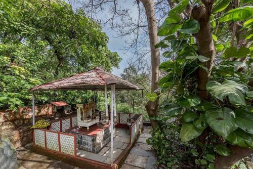 Κήπος έξω από το CosmicStays Windchime Homestay at Mulshi