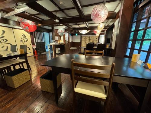 a dining room with a large table and chairs at Daikokuya - Vacation STAY 84428v in Kokonoe