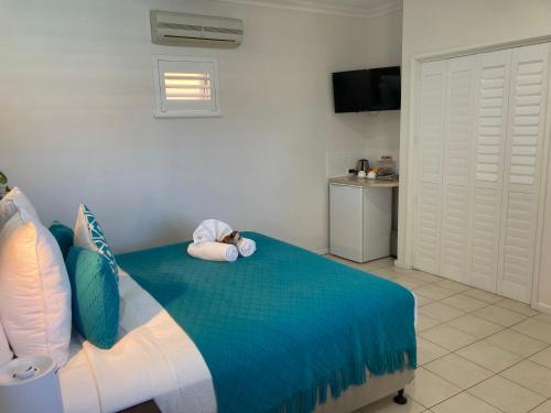 Ένα ή περισσότερα κρεβάτια σε δωμάτιο στο Gecko Lodge Kalbarri
