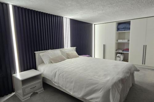 Katil atau katil-katil dalam bilik di Knightsbridge Seaside Duplex