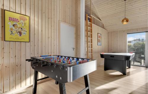 a room with a ping pong table and a sink at Lovely Home In Tisvildeleje With Sauna in Holløselund
