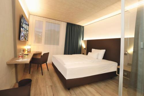 Hotel im Zentrum für Visionenにあるベッド