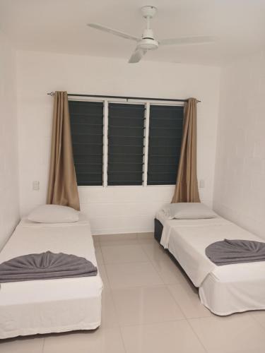 Postel nebo postele na pokoji v ubytování Saolan House Samoa