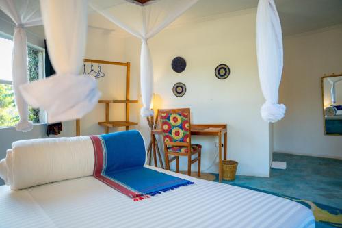 Postel nebo postele na pokoji v ubytování Dan Stam Hotel