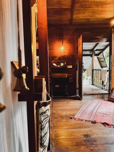 a hallway of a house with wooden floors and a room at Resort JUNGLEROOM Canggu in Canggu