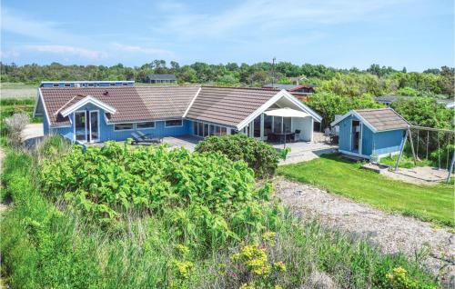 an aerial view of a blue house at Holiday Home Ørnevej Sjællands Odde Denm in Yderby