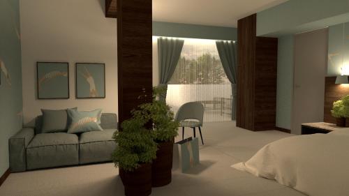 a living room with a couch and a chair at Hotel Europa Lignano in Lignano Sabbiadoro