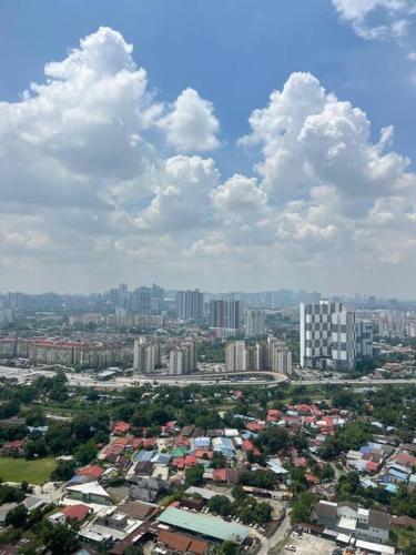an aerial view of a city with buildings and clouds at Cozy kenwingston platz kl 2-5pax 2BR&2BR Klcc view pakin netflx 3705A in Kuala Lumpur