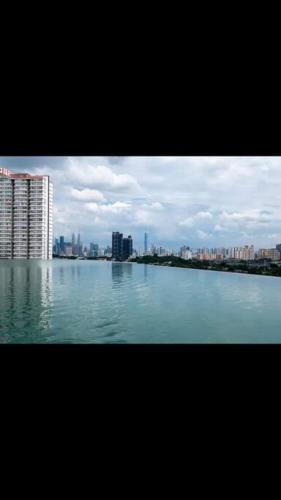 a large body of water with a city in the background at Cozy kenwingston platz kl 2-5pax 2BR&2BR Klcc view pakin netflx 3705A in Kuala Lumpur