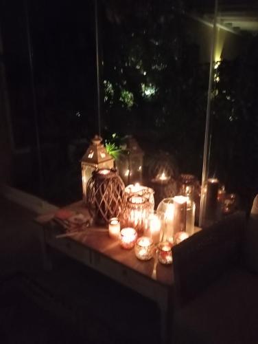 a group of candles on a table at night at Casolare Isabella "Il rifugio dei vinili" and Alice's room in Ponsacco
