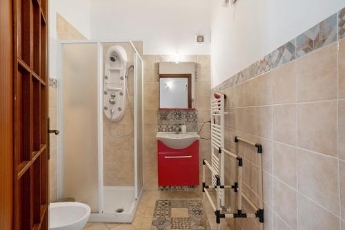 a small bathroom with a sink and a toilet at La Vista Sul Golfo in Massa Lubrense