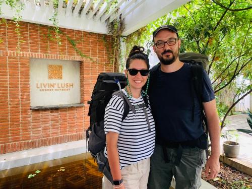a man and a woman standing in front of a building at Livin Lush Luxury Retreat in Anuradhapura