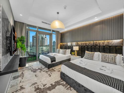 a hotel room with two beds and a large window at WonderfulStay at Paramount Residences - Highest Infinity Pool - Burj Khalifa View - Brand New Luxury Apartments in Dubai