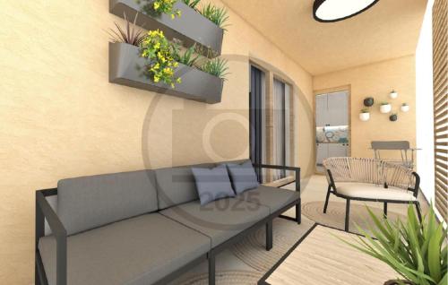 una sala de estar con un sofá y una silla en Cozy Apartment In Starigrad Paklenica, en Starigrad-Paklenica