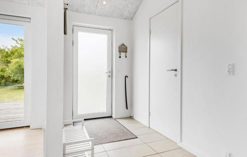 a hallway with white walls and a door at 3 Bedroom Beautiful Home In Nexø in Neksø